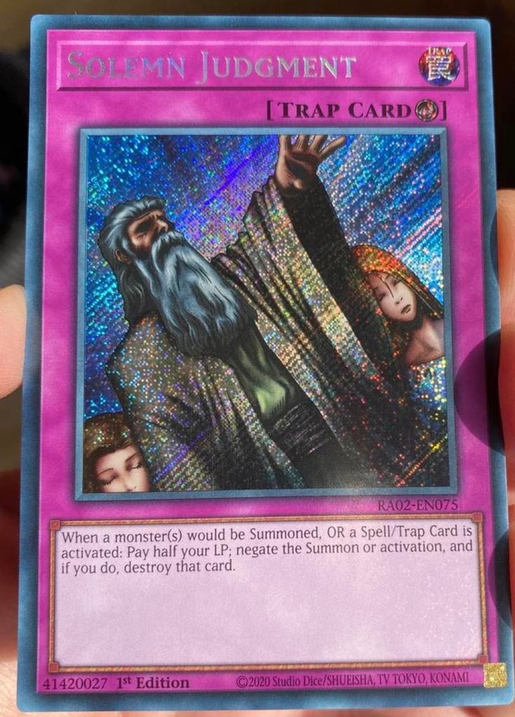 Yu-Gi-Oh! Solemn Judgment RA02 1st Edition !, Ophalen of Verzenden, Zo goed als nieuw, Losse kaart, Foil