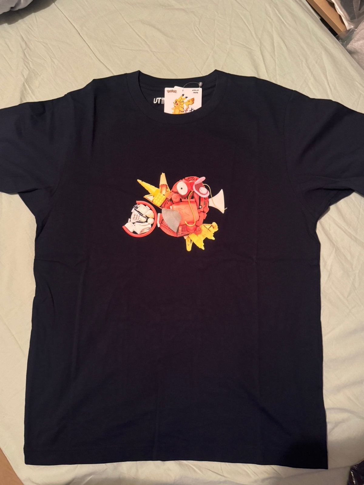 Uniqlo x Pokemon Magikarp shirt in maten: XS / S / M / L, Ophalen of Verzenden, Nieuw, Maat 48/50 (M), Blauw
