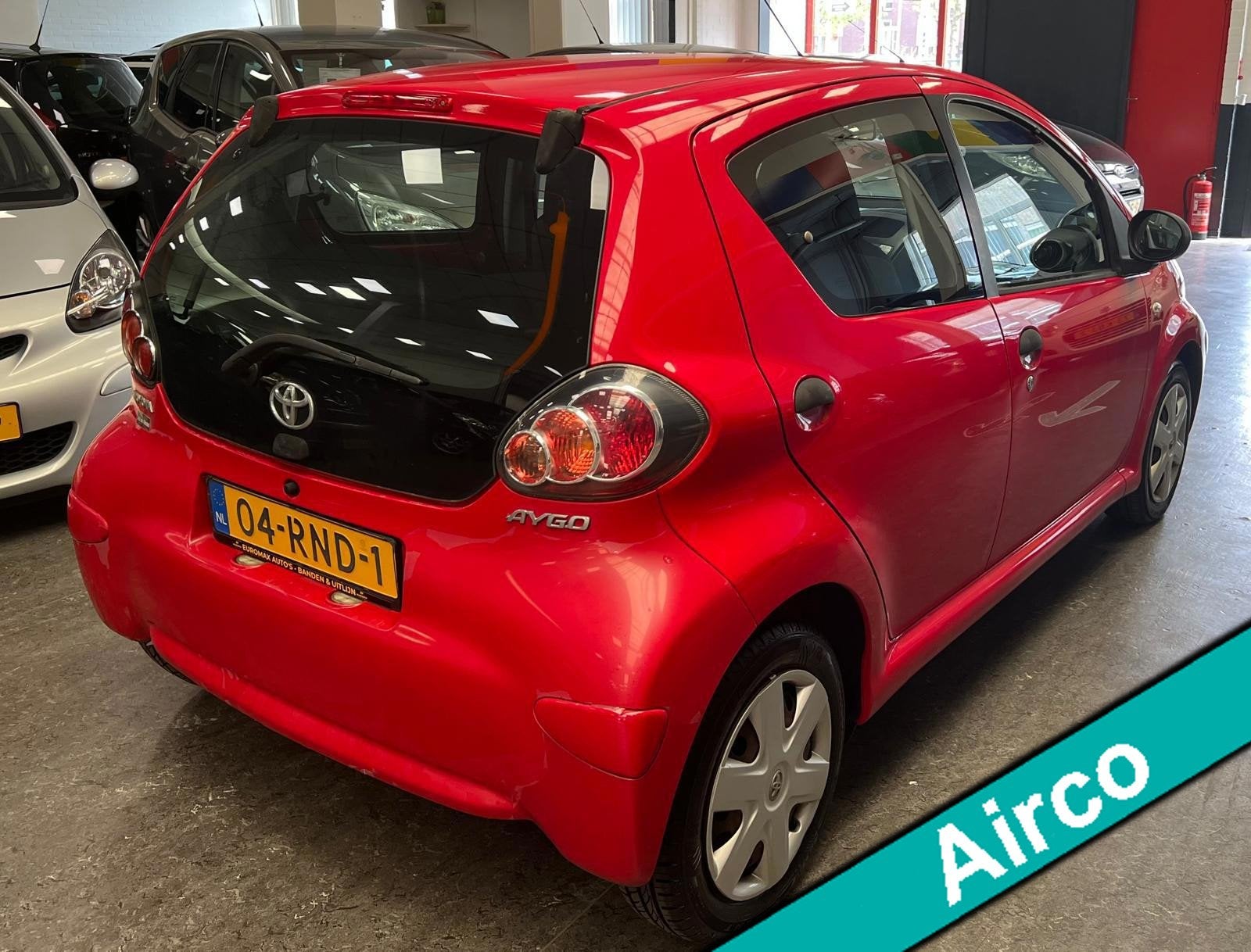 Toyota Aygo 1.0-12V Now 1e Eigenaar - NAP - Elektr. Raam, Auto's, Voorwielaandrijving, Euro 5, Stof, Gebruikt