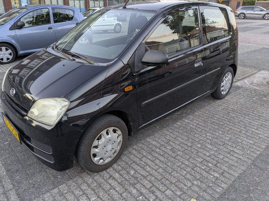 Daihatsu Cuore 1.0 3D 2006 Zwart, Auto's, Daihatsu, Stof, 600 kg, Zwart, 18 €/maand