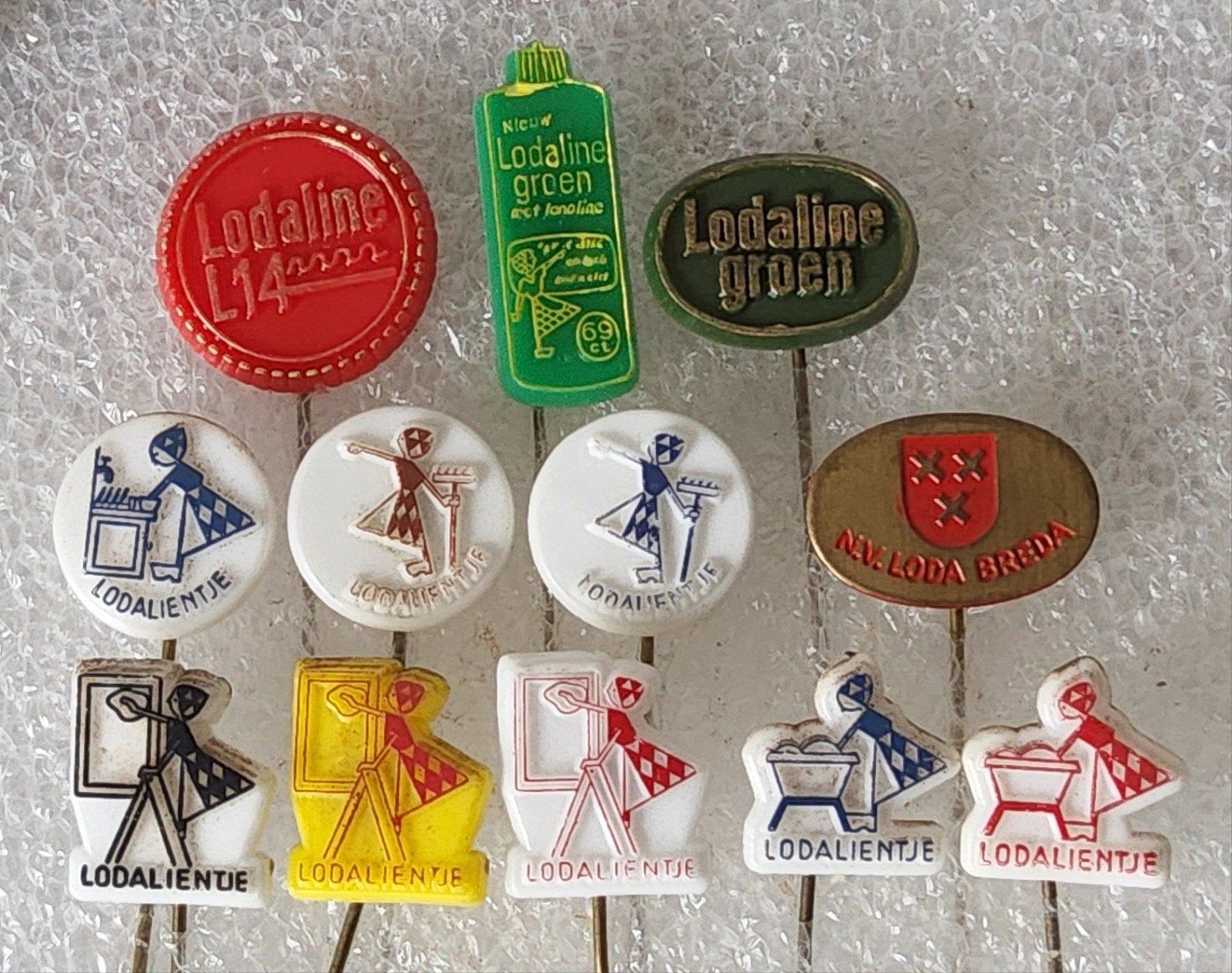 12 Vintage Loda Breda Speldjes - Lodaline Reclame, Ophalen of Verzenden, Gebruikt, Merk, Speldje of Pin
