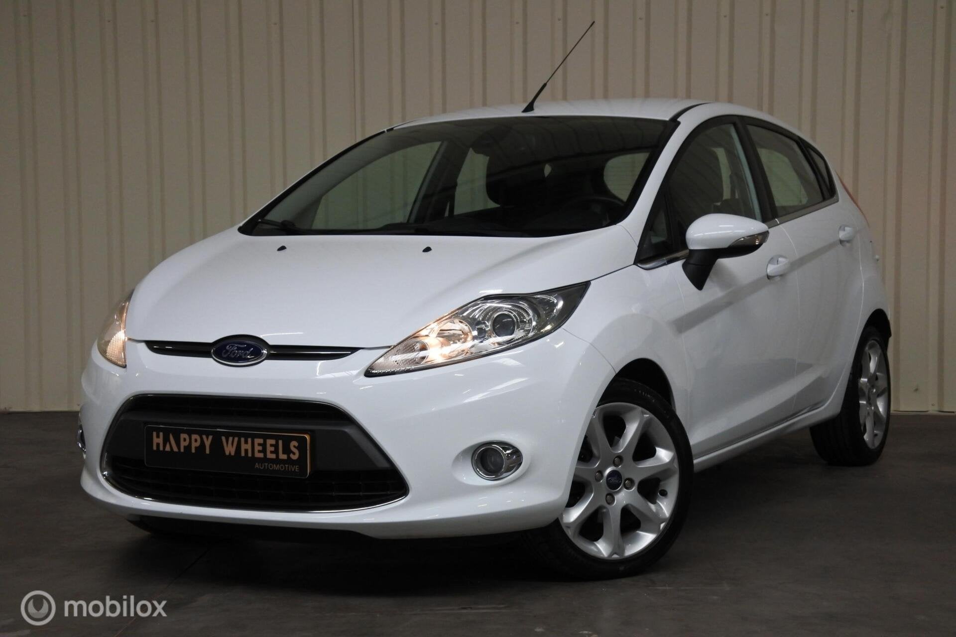 Ford Fiesta I 1.25 I Titanium I Airco I Cruise I Parkeerhulp, Voorwielaandrijving, Euro 5, Stof, Met garantie (alle)