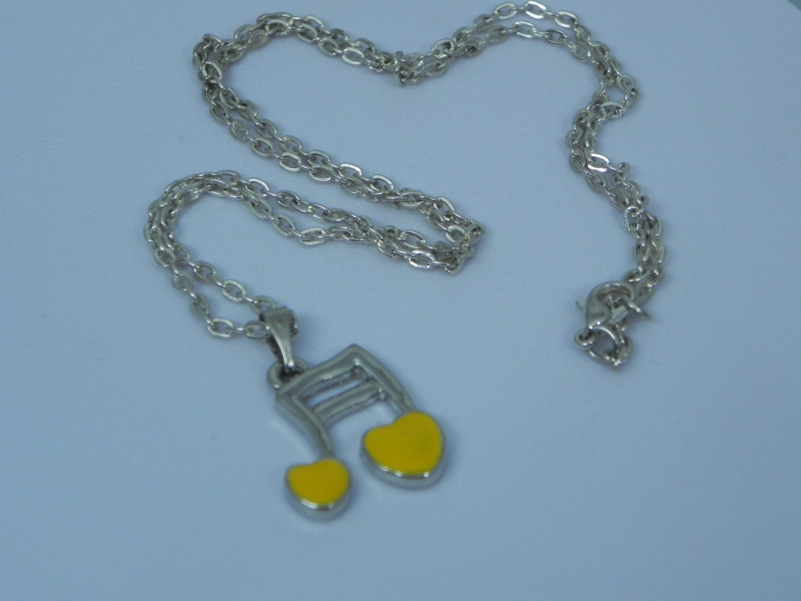 Zilverkleurige ketting met Muzieksleutel hanger, Sieraden, Tassen en Uiterlijk, Kettingen, Verzenden, Nieuw, Zilver, Overige materialen