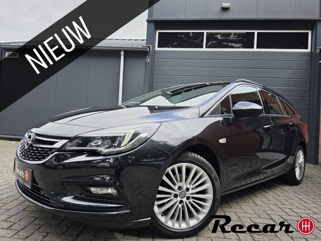 Opel Astra Sports Tourer - 1.0 Innovation/113Nap/DealerOh/Ke, Auto's, Opel, Gebruikt, 1178 kg, Zwart, Leder