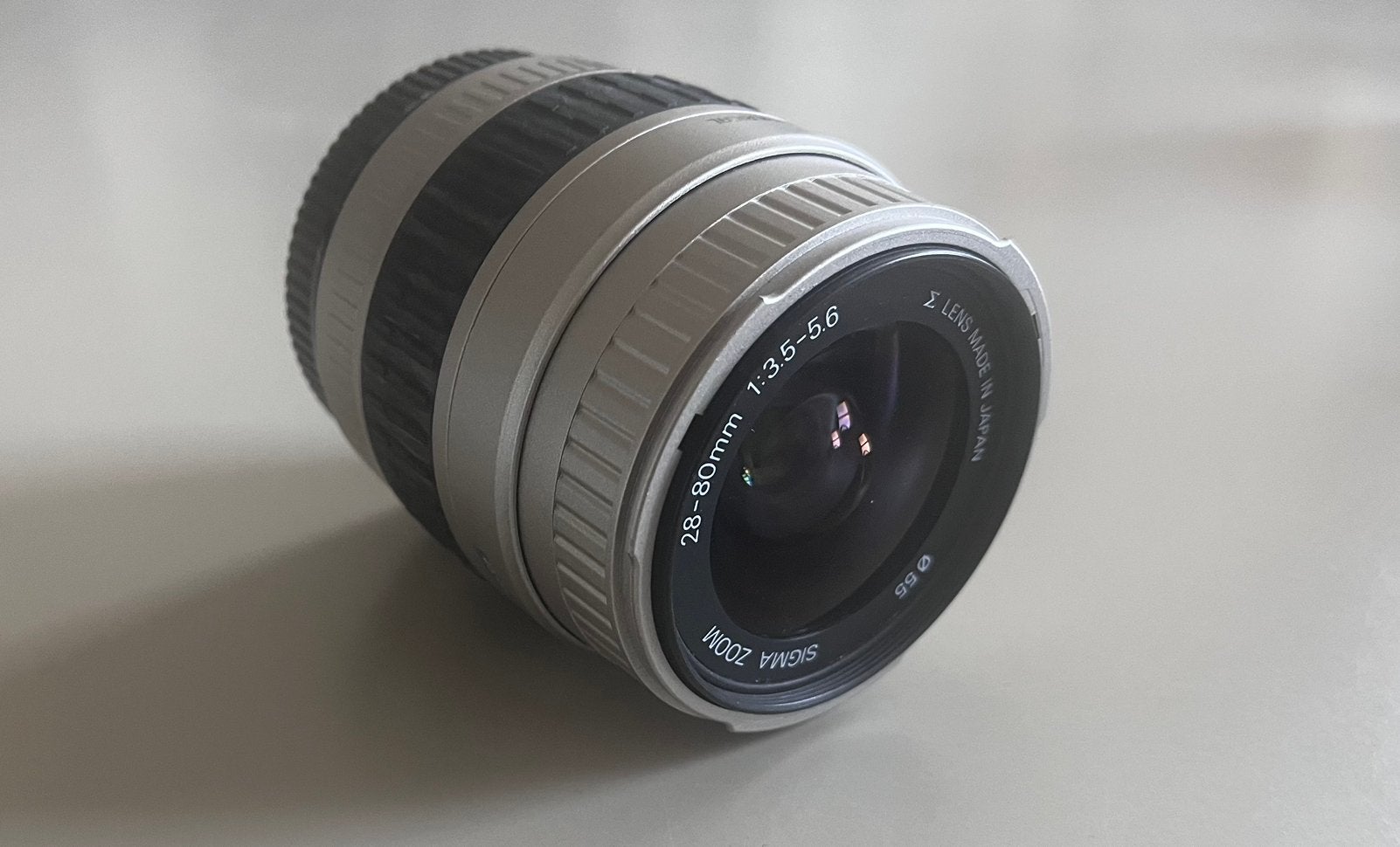 Sigma zoomlens 28-80 mm 1:3.5-5.6, Ophalen of Verzenden, Gebruikt, Telelens