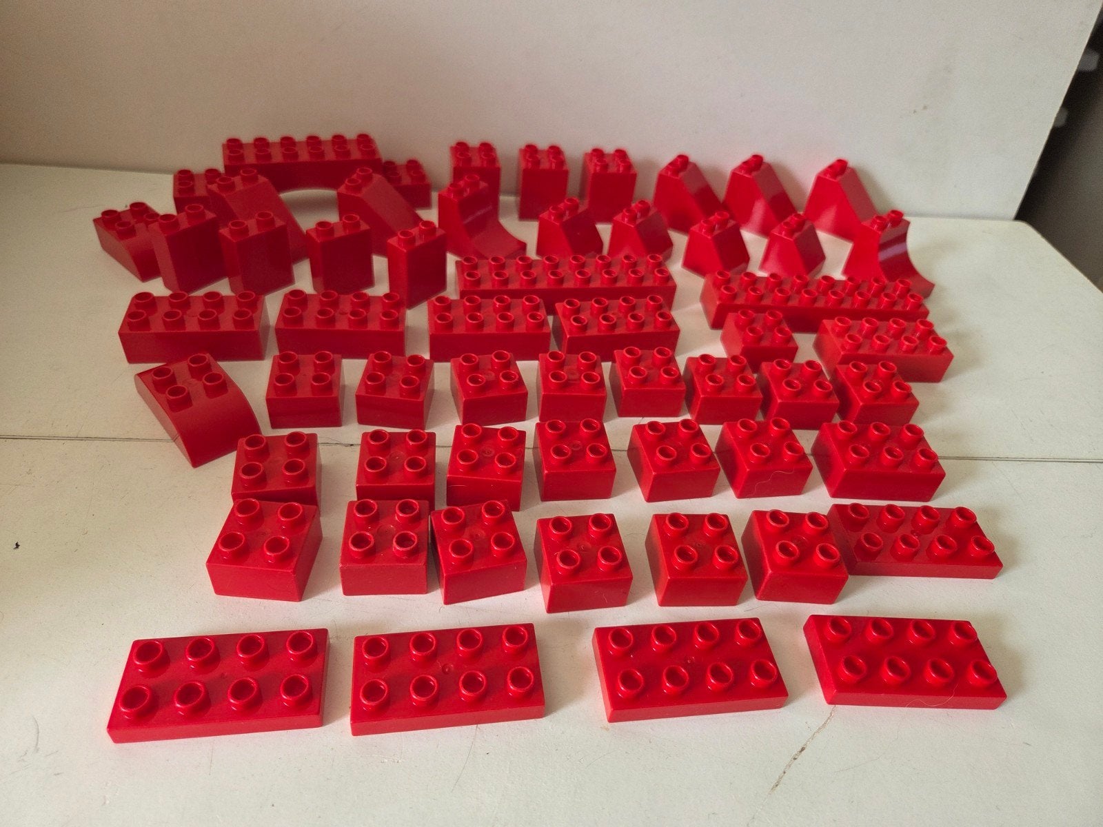 Lego Duplo 55 rode bouwstenen, Ophalen of Verzenden, Zo goed als nieuw