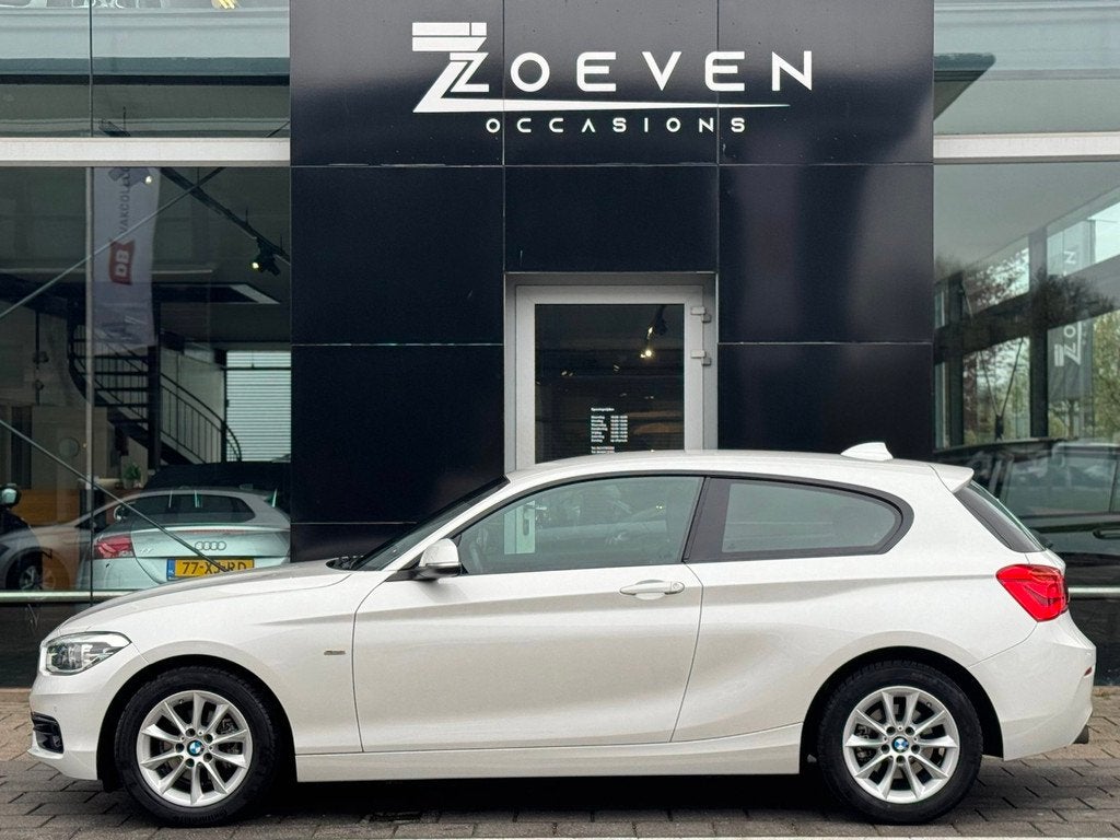 BMW 1-serie 118i Centennial High Executive/ Automaat/Navi, Auto's, Gebruikt, 1290 kg, 4 stoelen, Wit