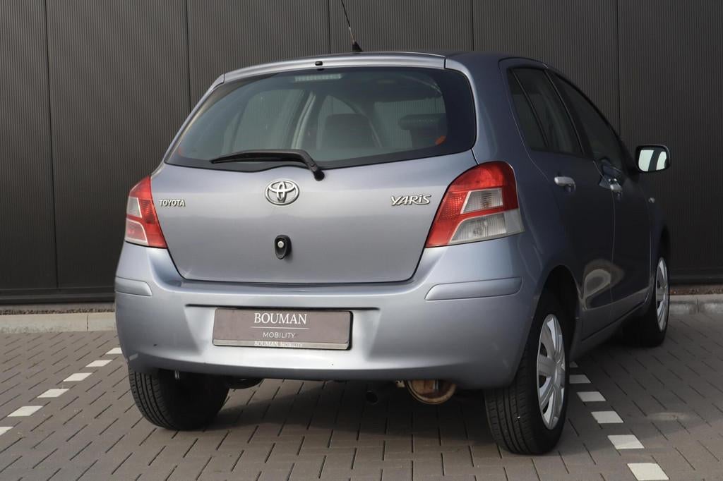 Toyota Yaris 1.3 VVTi Aspiration AUTOMAAT, CLIMATE DEALER OH, 4 cilinders, Blauw, 19 km/l, 550 kg