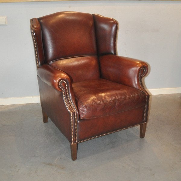 Schapenleren oorfauteuil i.z.g.s. Muylaert, Huis en Inrichting, Fauteuils, Ophalen, Zo goed als nieuw, 75 tot 100 cm, Leer