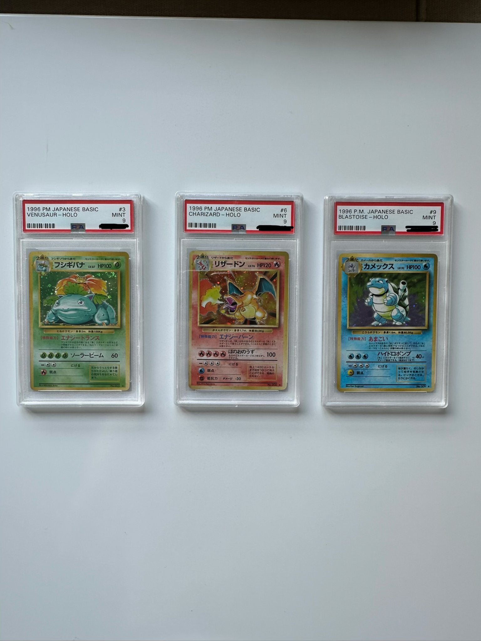 PSA 9 1996 Japanese Venusaur, Charizard & Blastoise, Ophalen of Verzenden, Zo goed als nieuw, Meerdere kaarten, Foil