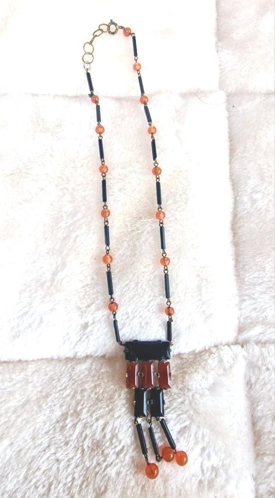 Vintage ketting met oranje en zwarte kralen, Gebruikt, Oranje, Ophalen of Verzenden, Overige materialen