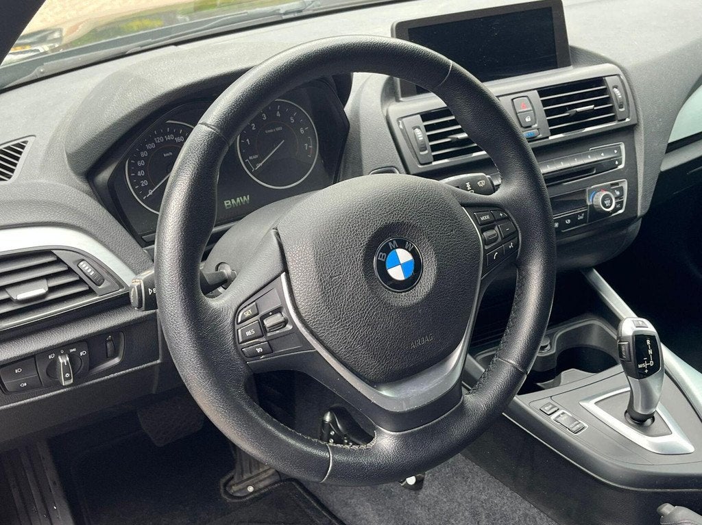 BMW 1-serie 116i High Executive Xenon/Led, Climat, Airco, Na, Auto's, Euro 6, 4 cilinders, Automatische klimaatregeling, Zwart