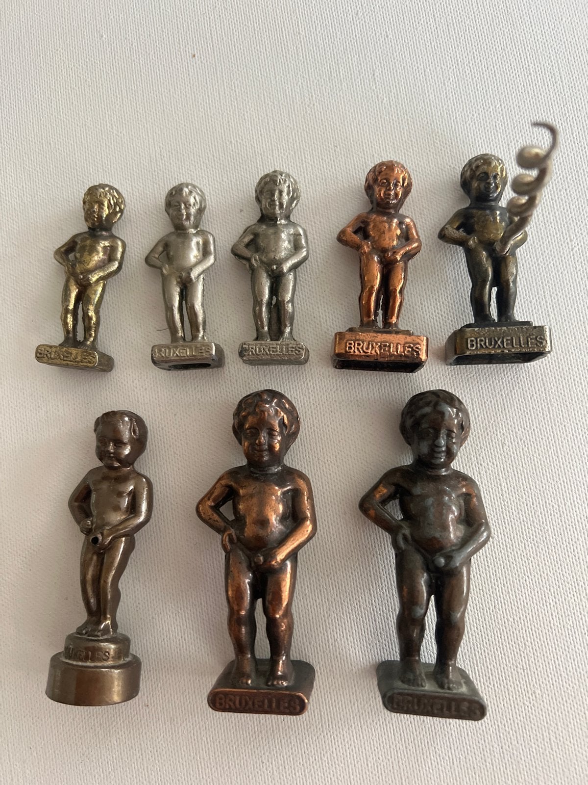 Verzameling 8 Manneken Pis beeldjes en kurkentrekker, Ophalen of Verzenden