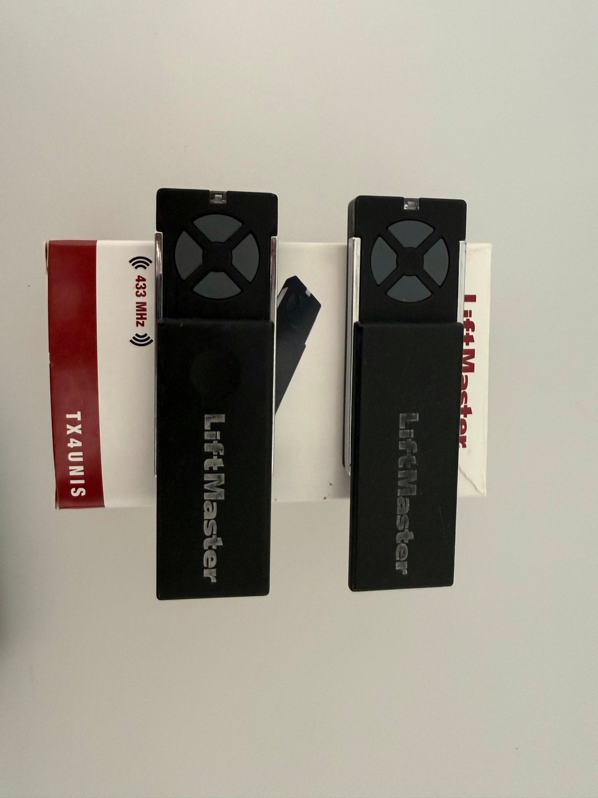 2 LiftMaster TX4UNIS afstandsbedieningen + ontvanger, Ophalen, Zo goed als nieuw