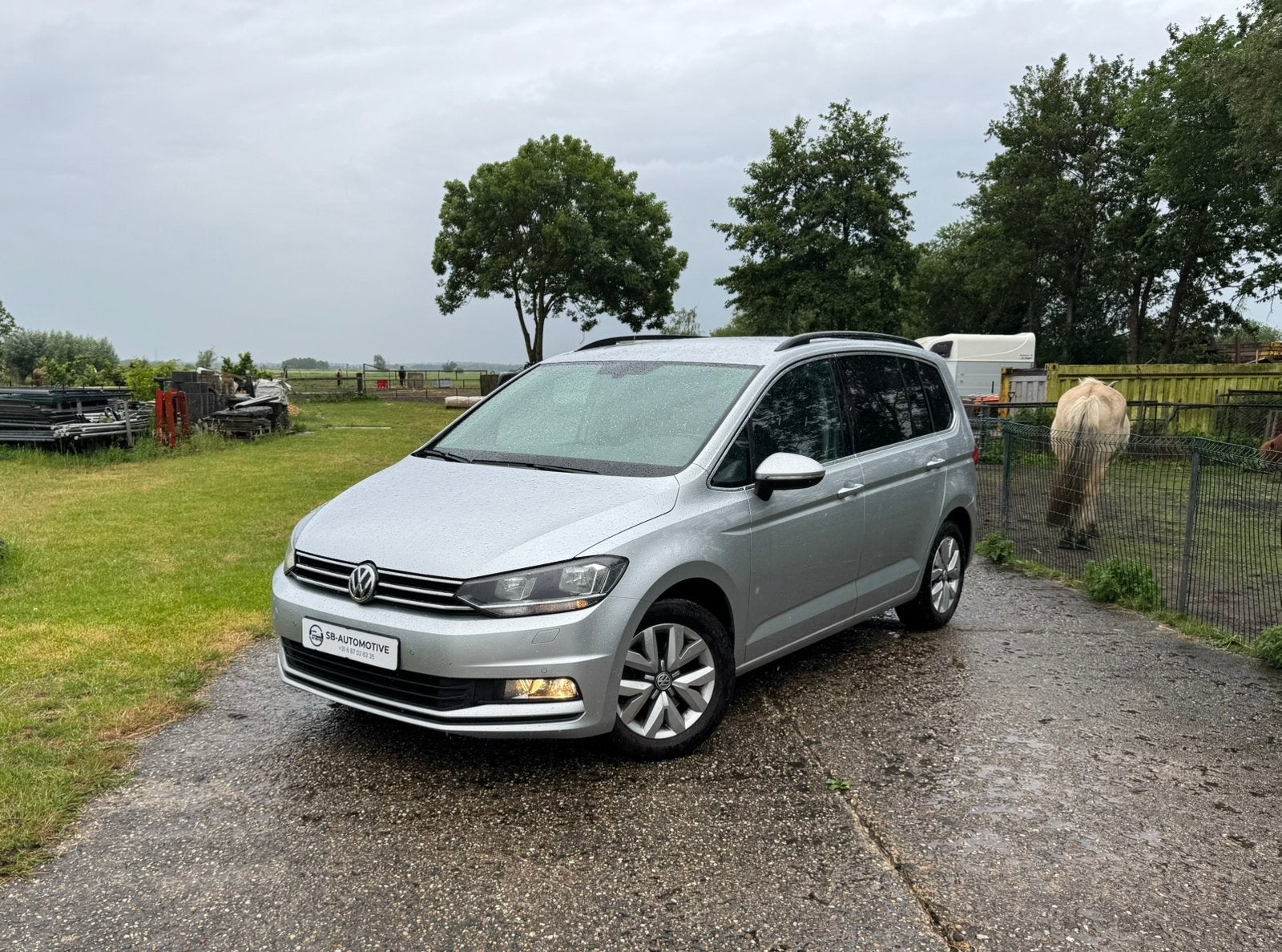 Volkswagen Touran 1.4 TSI 110KW DSG Highline 7P 2016 Grijs, Auto's, Automaat, 150 pk, Zilver of Grijs, MPV