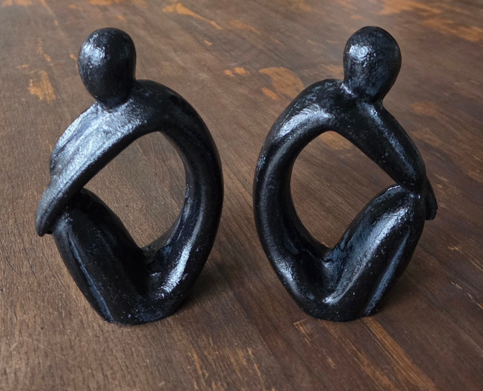 2 Abstracte, gietijzeren sculpturen / boekensteunen, Ophalen of Verzenden