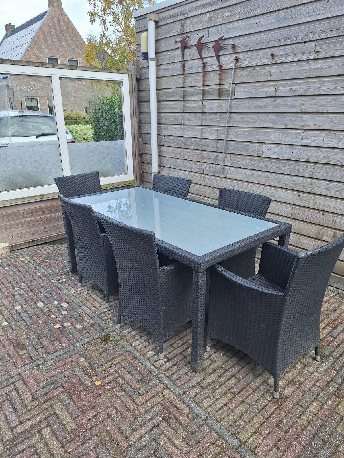 Wicker tuinset met glazen tafel en 6 stoelen, Ophalen, Gebruikt, 6 zitplaatsen, Wicker