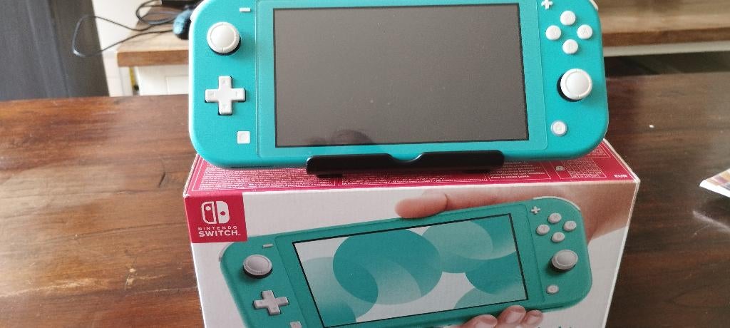 turkooise nintendo switch lite.helemaal compleet, Spelcomputers en Games, Ophalen of Verzenden, Zo goed als nieuw, Zonder controller