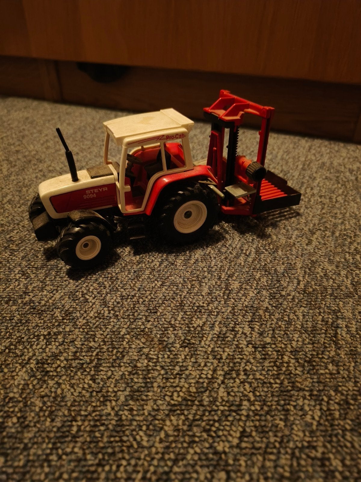 siku steyr 9094 met kuilvoersnijder, Hobby en Vrije tijd, Ophalen of Verzenden, Tractor of Landbouw, SIKU