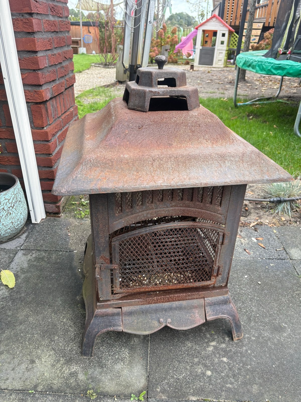 Robuuste gietijzeren buitenkachel - Sfeervol en functioneel, Tuin en Terras, Ophalen, Gebruikt