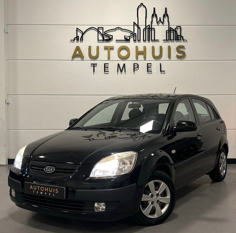 Kia Rio 1.4 All Stars Sport Automaat Airco Elektrische Ramen, Auto's, Kia, Stof, Gebruikt, 14 km/l, Grijs