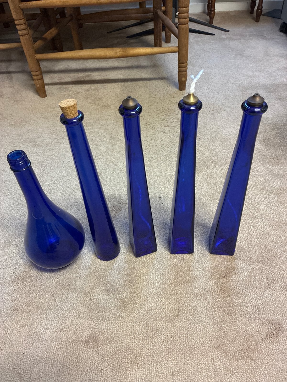 Set van 5 blauwe glazen flessen: olielampen en decoratie, Antiek en Kunst, Ophalen of Verzenden