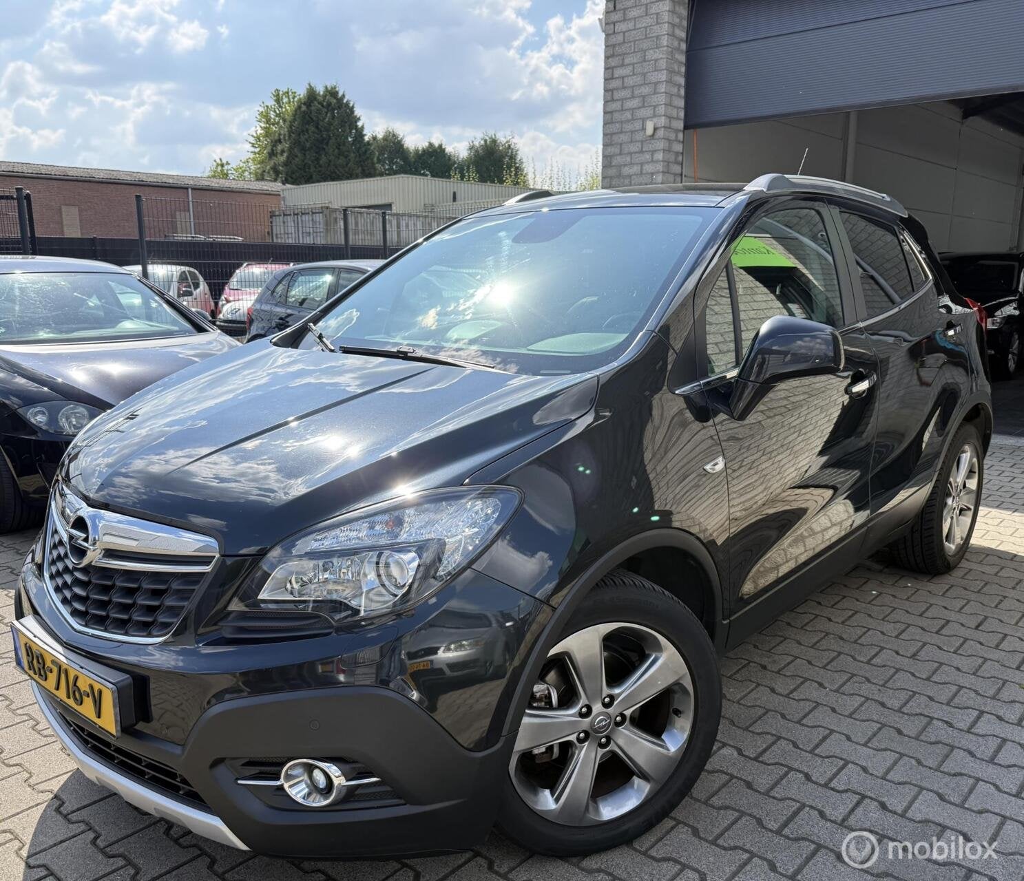 Opel Mokka 1.4 T Cosmo 4x4 / Navi / Leer / N.A.P, Auto's, Euro 5, Gebruikt, 4 cilinders, Zwart