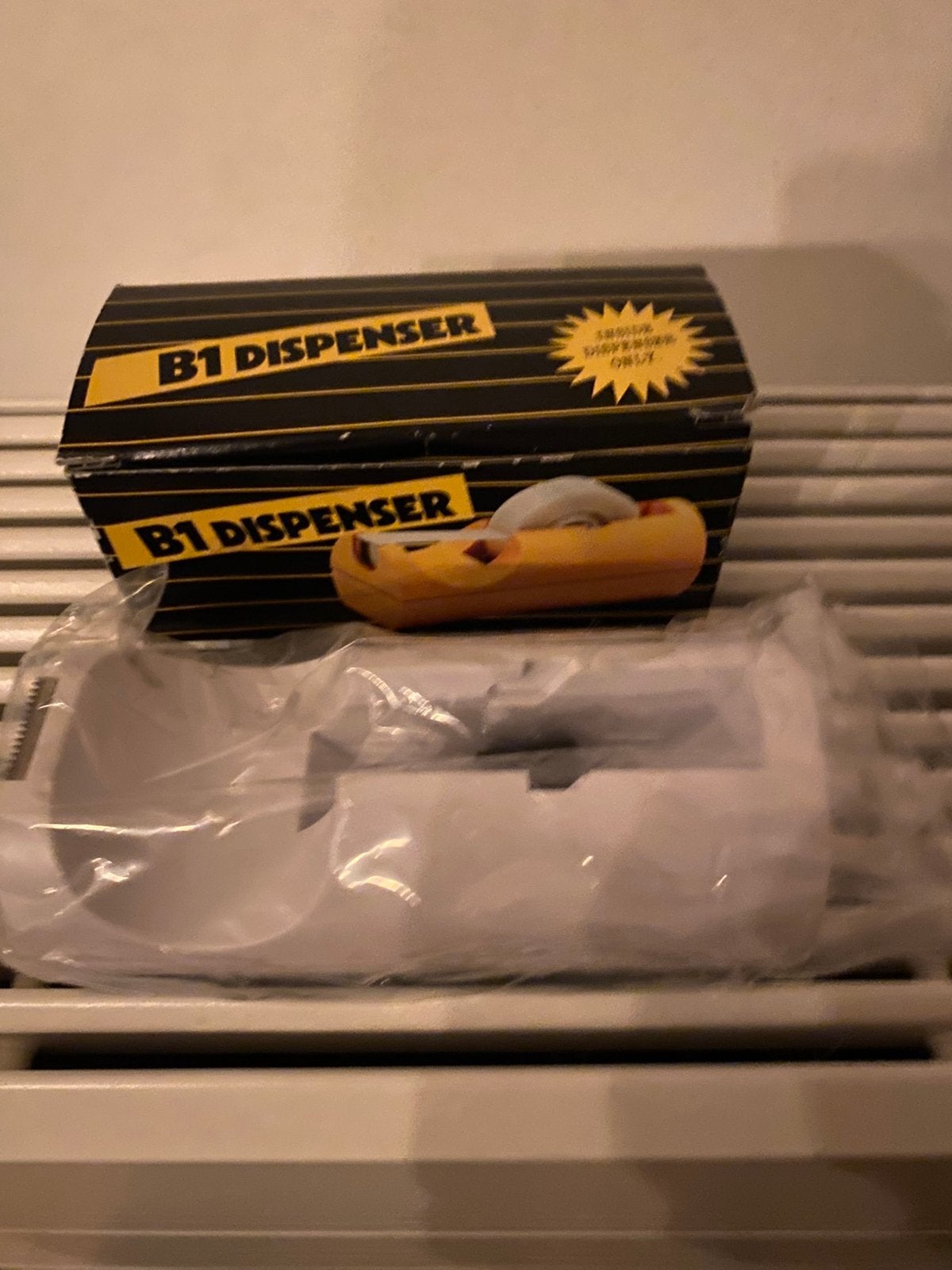 Plakbandhouder, Ophalen, Zo goed als nieuw