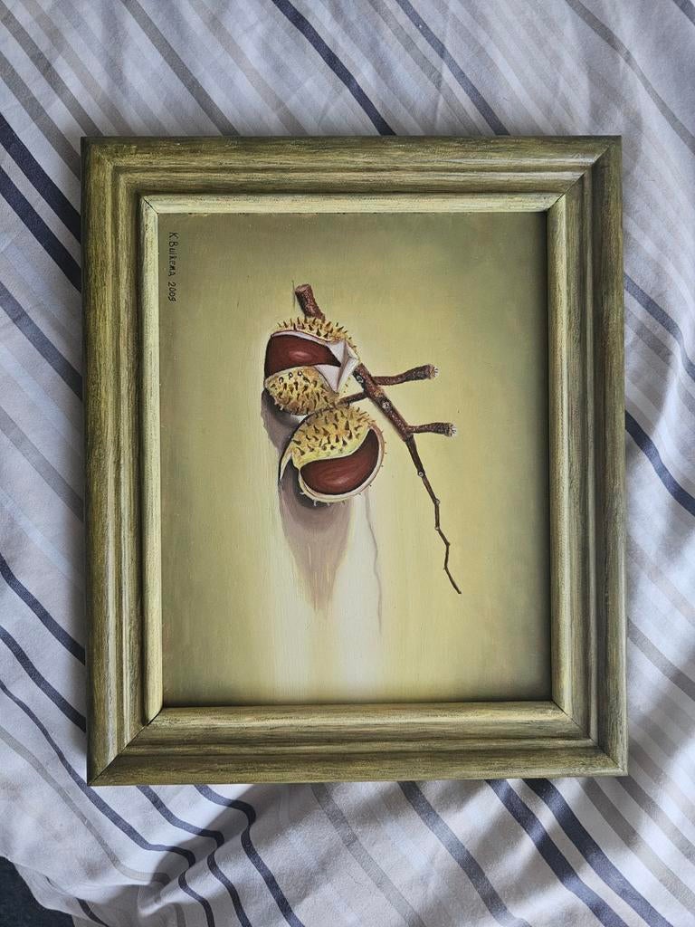 Stilleven schilderij van tamme kastanjes in lijst, Ophalen