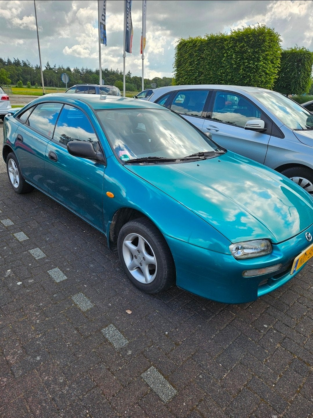 Mazda 323 1.5 I F GLX 1995 Groen, Voorwielaandrijving, 1489 cc, 4 cilinders, 400 kg