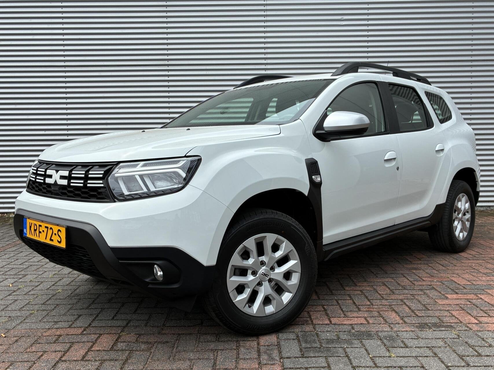 Dacia Duster 1.0 TCe Hoge Instap Airco cruise Carplay Led 23, Auto's, Voorwielaandrijving, Stof, Gebruikt, Wit
