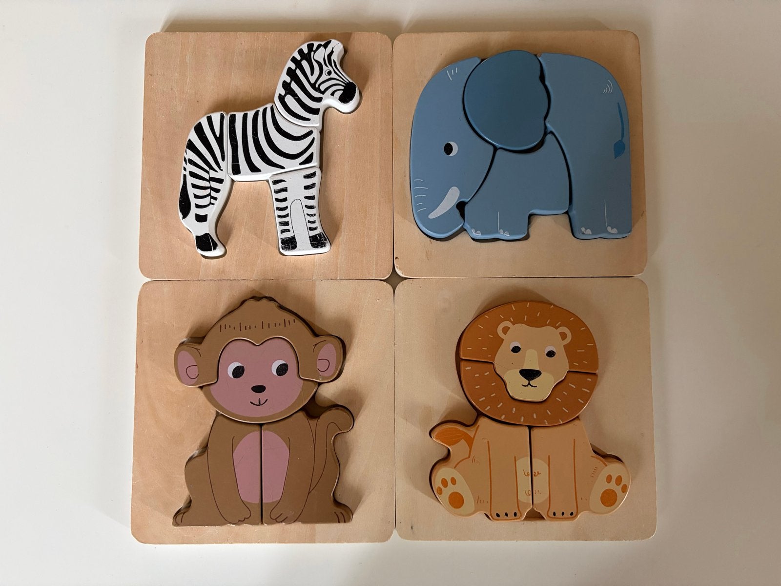 4 Houten Dieren Puzzels - Zebra, Aap, Leeuw, Olifant, Ophalen of Verzenden, Gebruikt, Overige typen