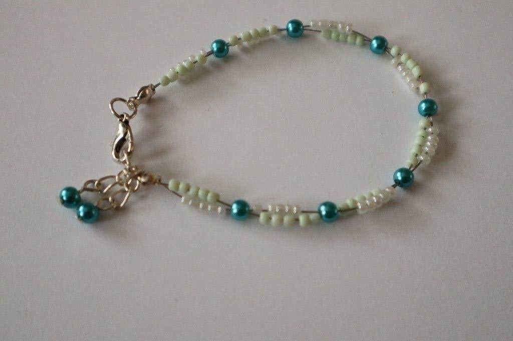 Handgemaakte kralenarmband in turquoise en mintgroen, Overige materialen, Nieuw, Ophalen of Verzenden, Met bedels of kralen