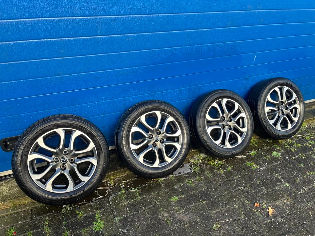 Originele Mazda Velgen met Banden 16 inch 4x100, Auto-onderdelen, Banden en Velgen, Banden en Velgen, Zomerbanden, 16 inch, 185 mm