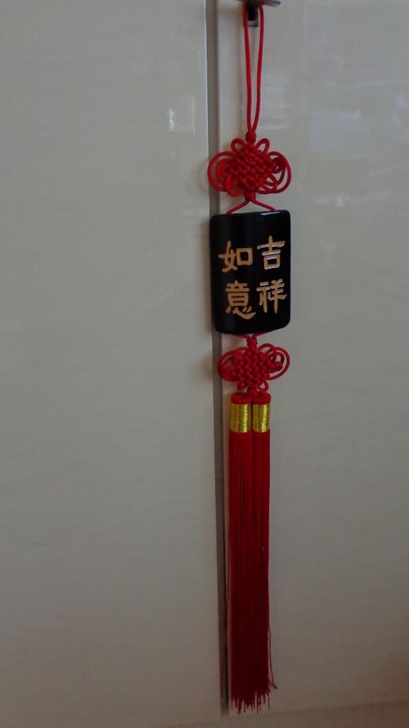 Chinese wanddecoratie Gelukshanger, Ophalen
