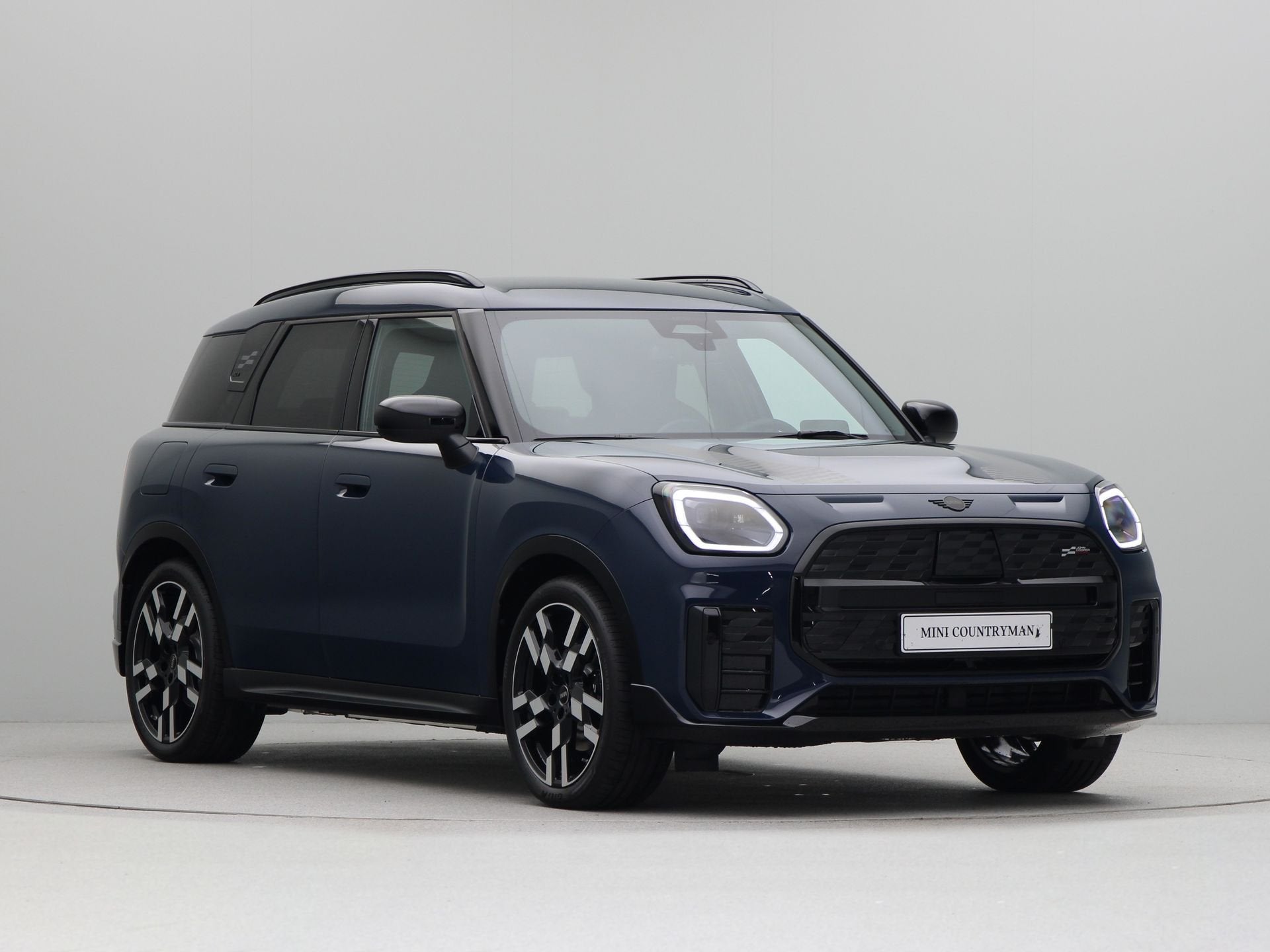 MINI Countryman SE ALL4 John Cooper Works Pakket S PRIVATE L, Auto's, Automaat, Zwart, Countryman, Blauw