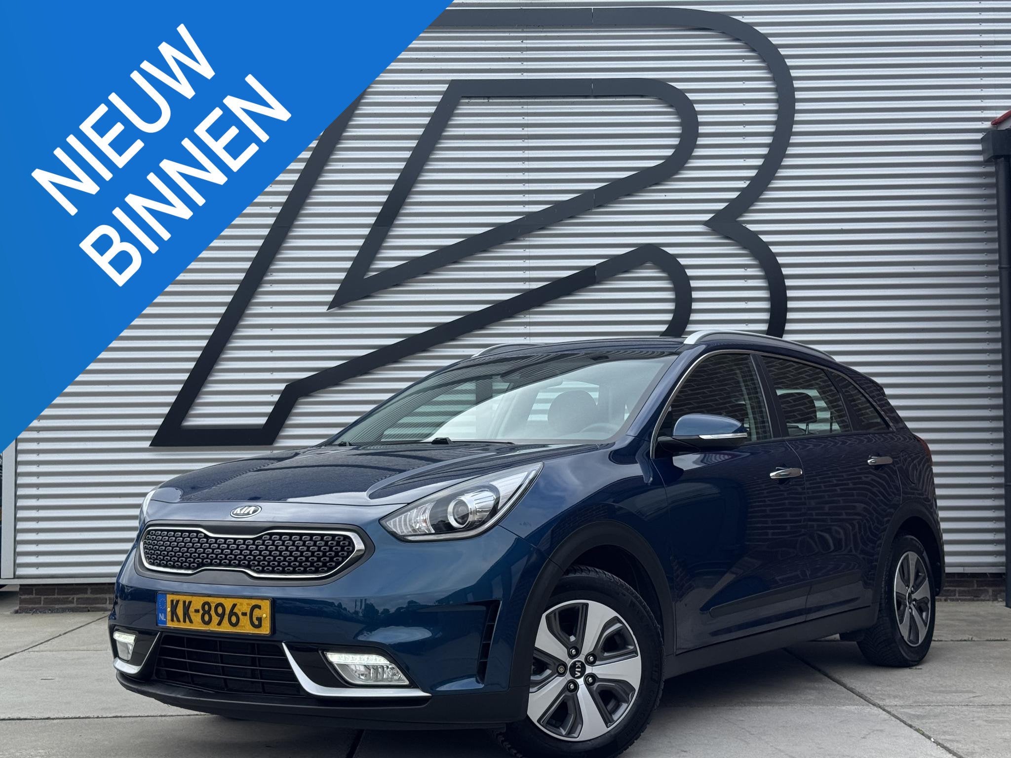 Kia Niro 1.6 GDi Hybrid First Edition 1e Eigenaar|Navi|Camer, Auto's, Gebruikt, Euro 6, 2 kWh, Blauw