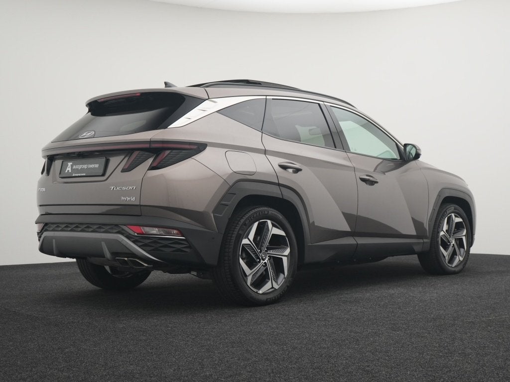 Hyundai Tucson 1.6 T-GDI PHEV 4WD 6AT 265PK Premium Sky | Pa, Auto's, 14 kWh, Gebruikt, 4 cilinders, Bedrijf