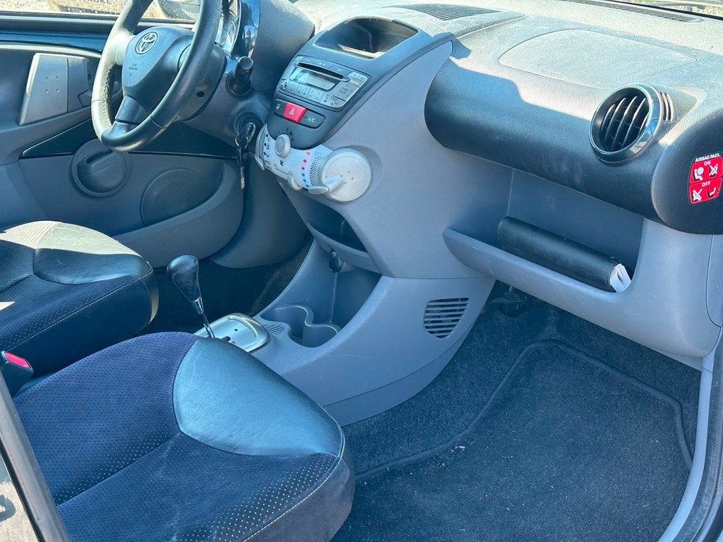Toyota Aygo 1.0-12V Aspiration Green Navigator/AIRCO/AUTOMAA, Euro 5, Gebruikt, Zwart, 4 stoelen