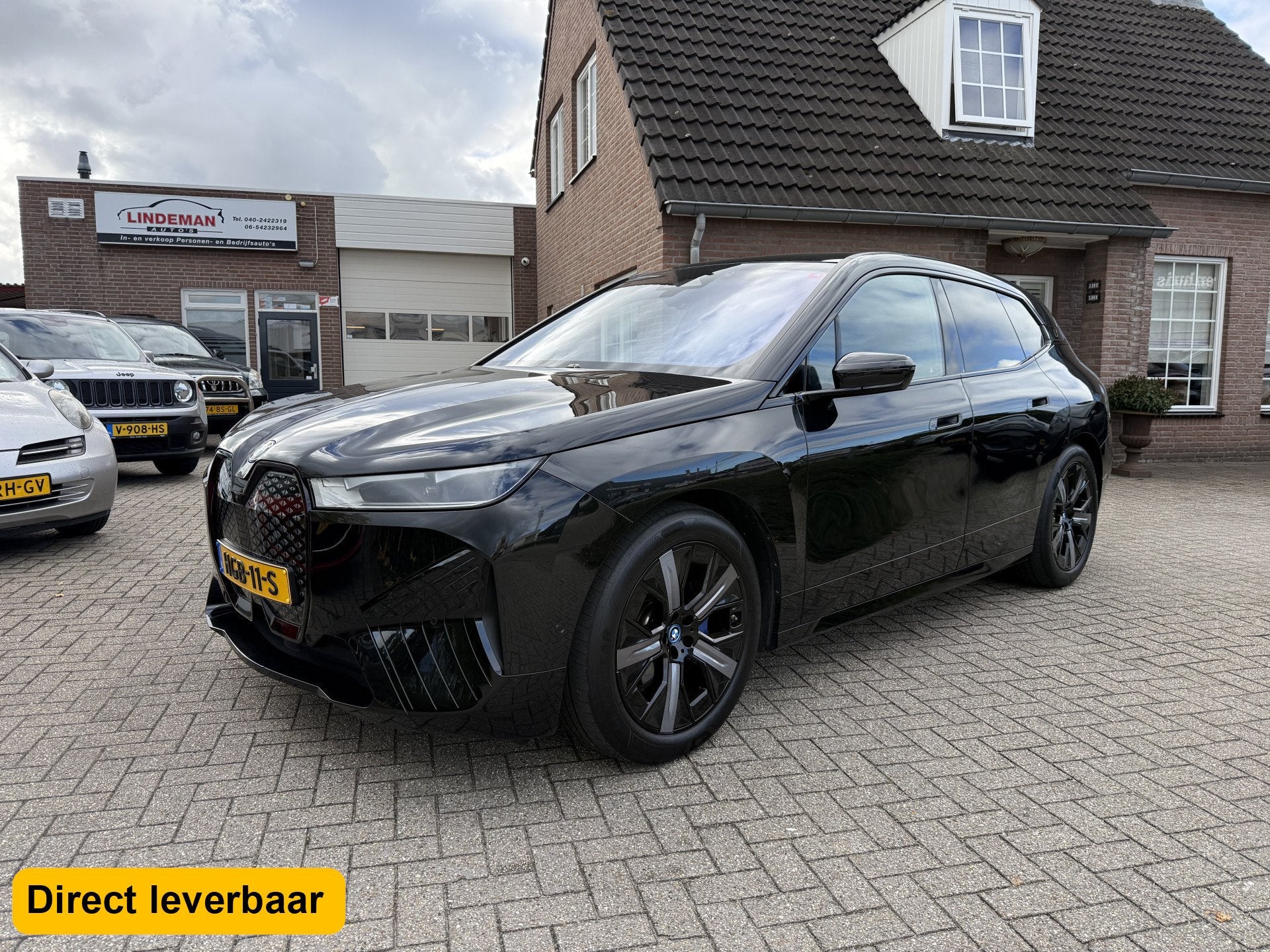 BMW iX xDrive40 Exec. Panoramadak Luchtvering Org.Nederlands, Auto's, Automaat, Dealer onderhouden, Gebruikt, Zwart