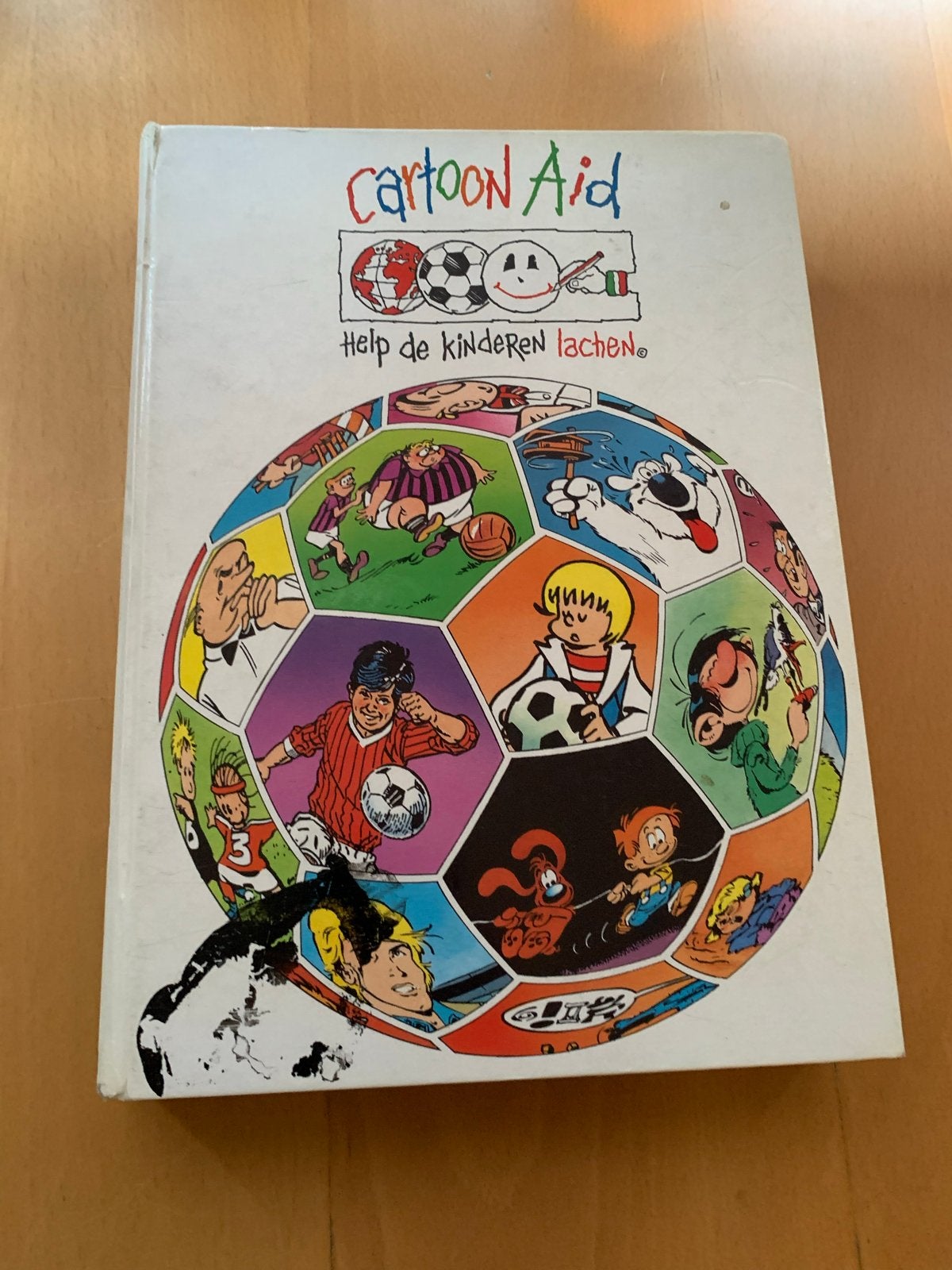 Cartoon Aid: Help de kinderen lachen - Stripboek, Boeken, Eén stripboek, Ophalen of Verzenden, Gelezen