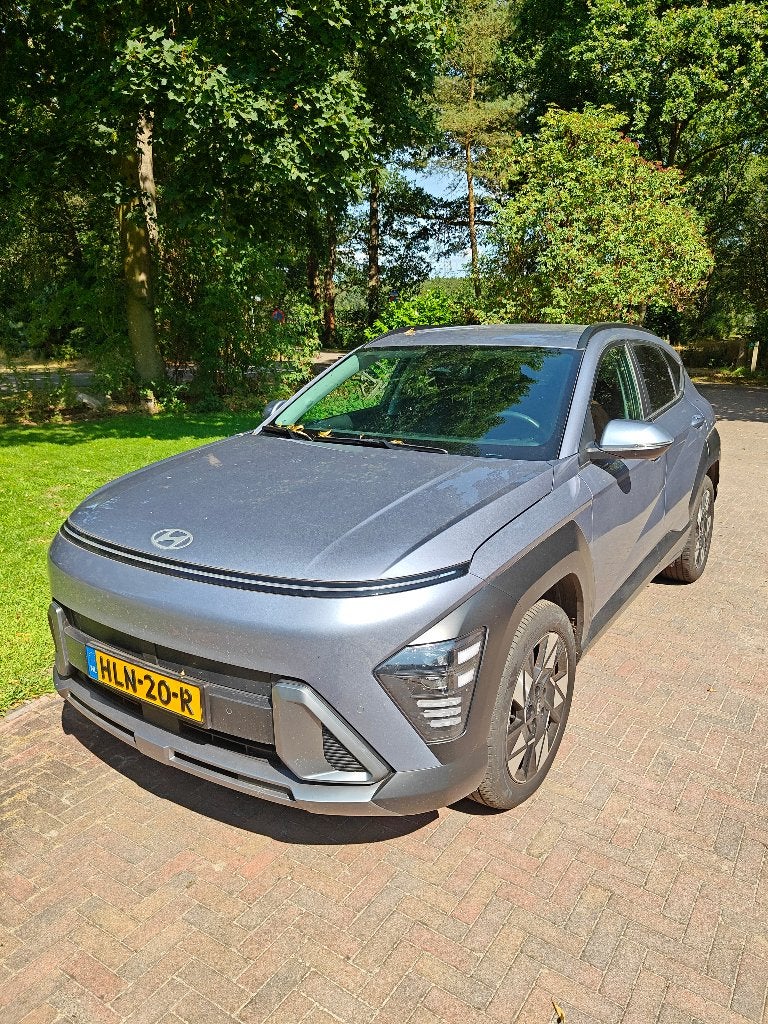 Hyundai Kona 1.6 GDI HEV 141pk DCT 2025 Blauw, Auto's, Stof, Euro 6, Blauw, Origineel Nederlands