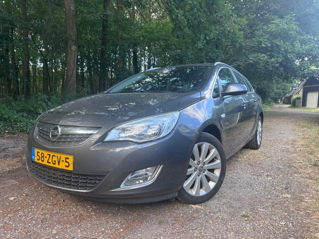 Opel Astra Sports Tourer 1.4 Turbo 2012 Cosmo CruiseClimate, Auto's, Voorwielaandrijving, 4 cilinders, Leder en Stof, Zwart