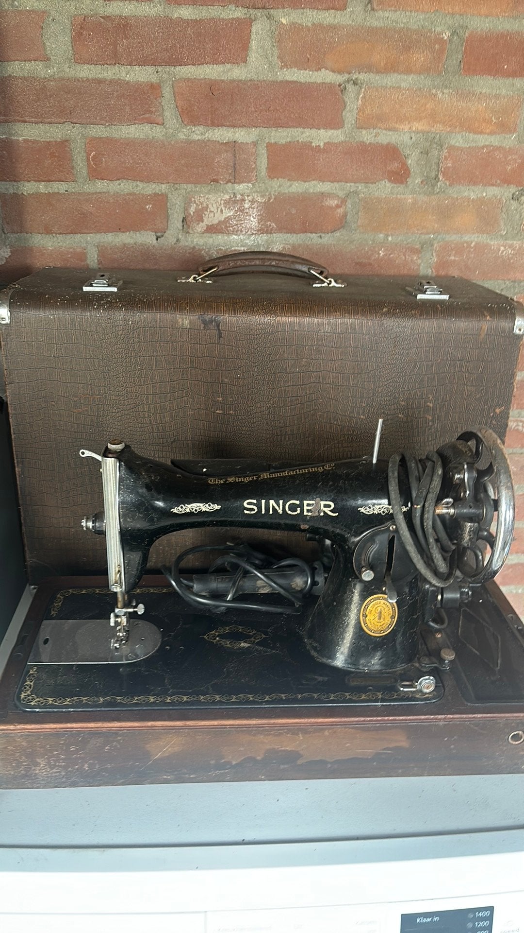 Singer antiek naai machine, Ophalen
