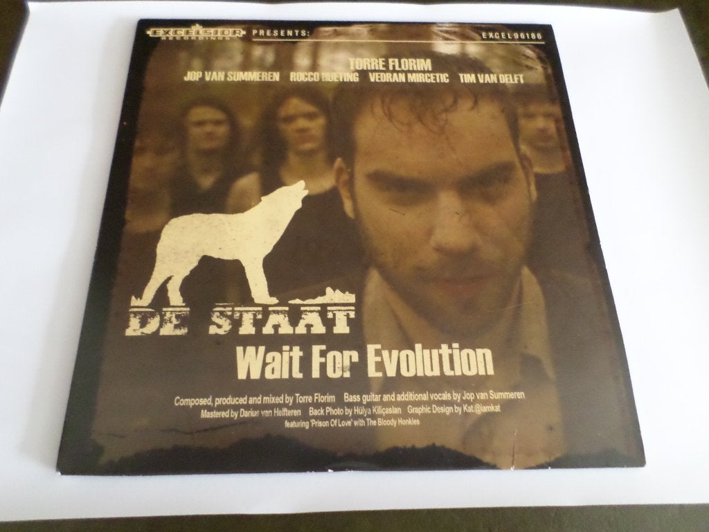 De Staat ‎- Wait For Evolution Vinylsingle Wit Vinyl, Originele persing, Ophalen of Verzenden, Zo goed als nieuw, Rock en Metal