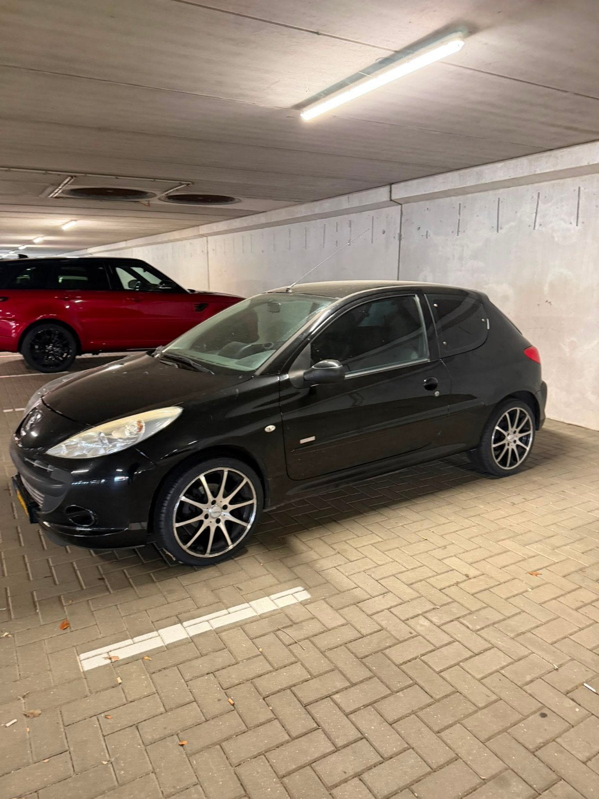 Peugeot 206+ 1.4 3D 2011 Zwart, Auto's, Voorwielaandrijving, 206+, Stof, Zwart