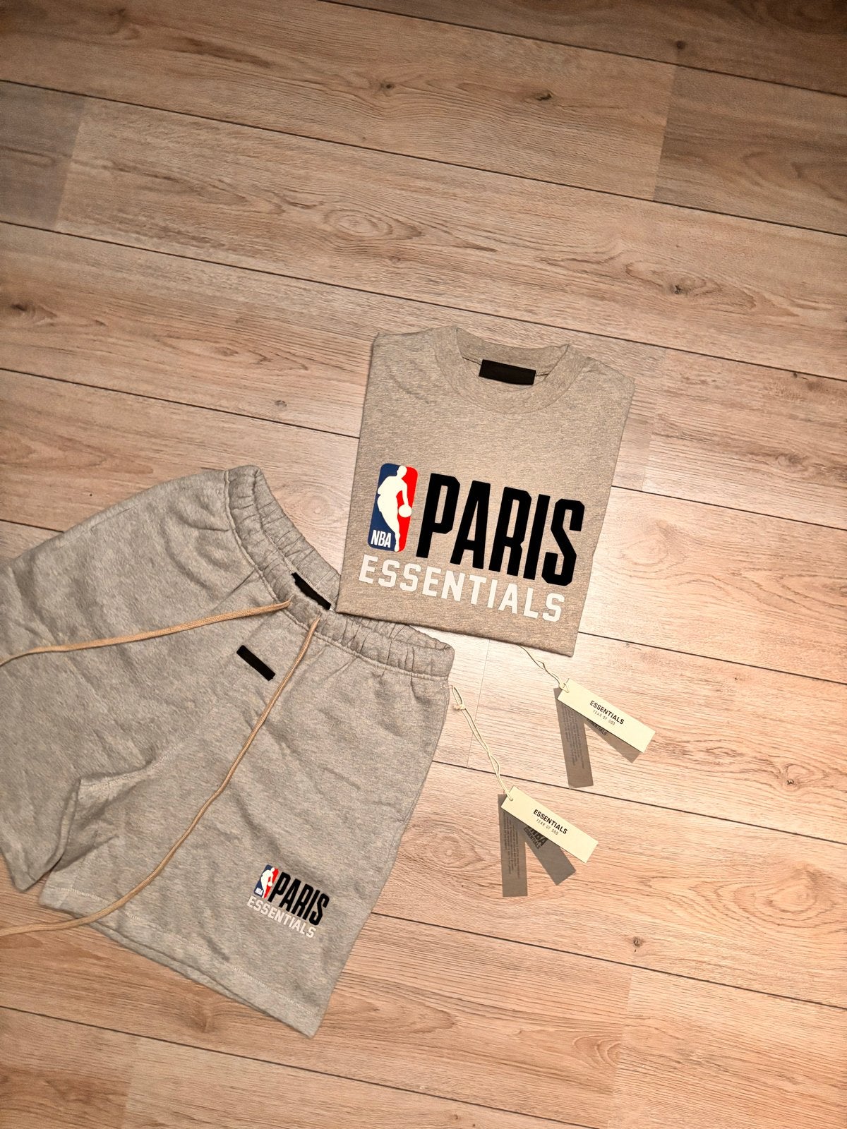 Fear of God Essentials NBA Paris T-shirt & Short Set, Ophalen of Verzenden, Nieuw, Maat 48/50 (M), Grijs