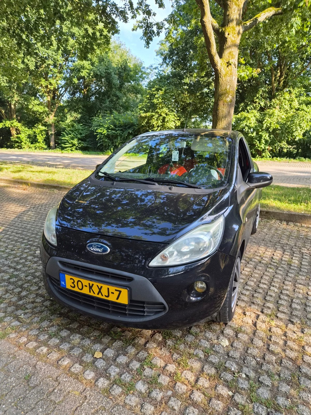 Ford Ka 1.2 51KW 2010 Zwart, Auto's, Ford, Voorwielaandrijving, 4 cilinders, 4 stoelen, Zwart