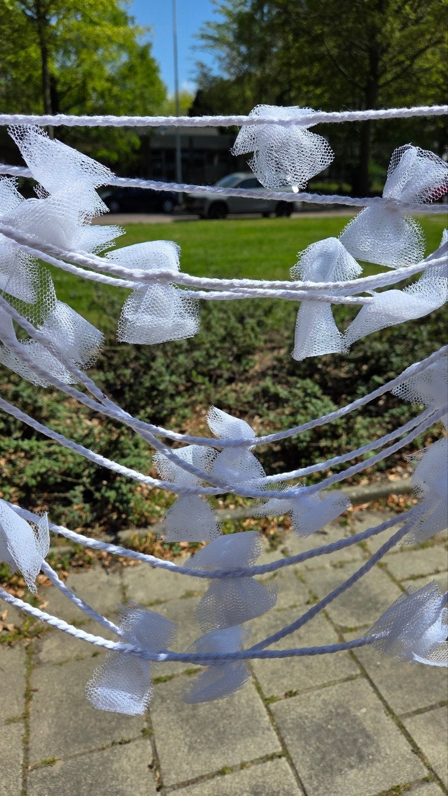 Slinger met witte strikjes, Ophalen, Versiering, Geboorte of Huwelijk