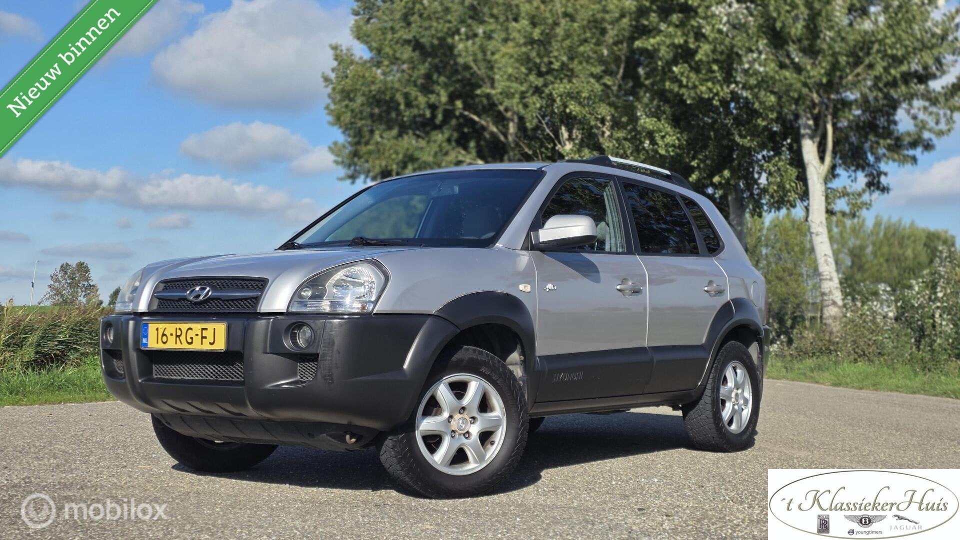 Hyundai Tucson 2.0i 4WD Style airco lage kilometerstand!, Stof, Gebruikt, 4 cilinders, Bedrijf